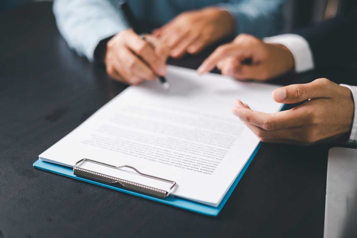 Employer signing an employee benefits program agreement