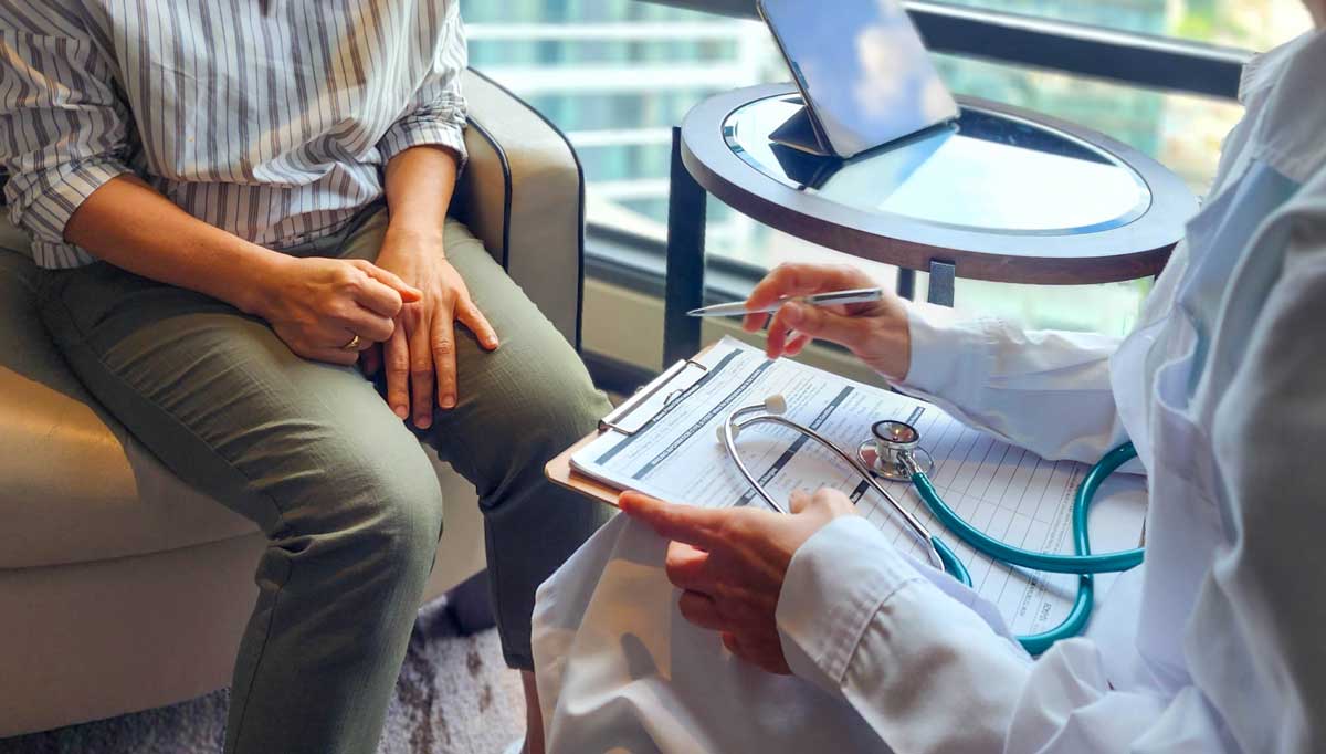Employee benefits consultant discussing small business health insurance options with a client